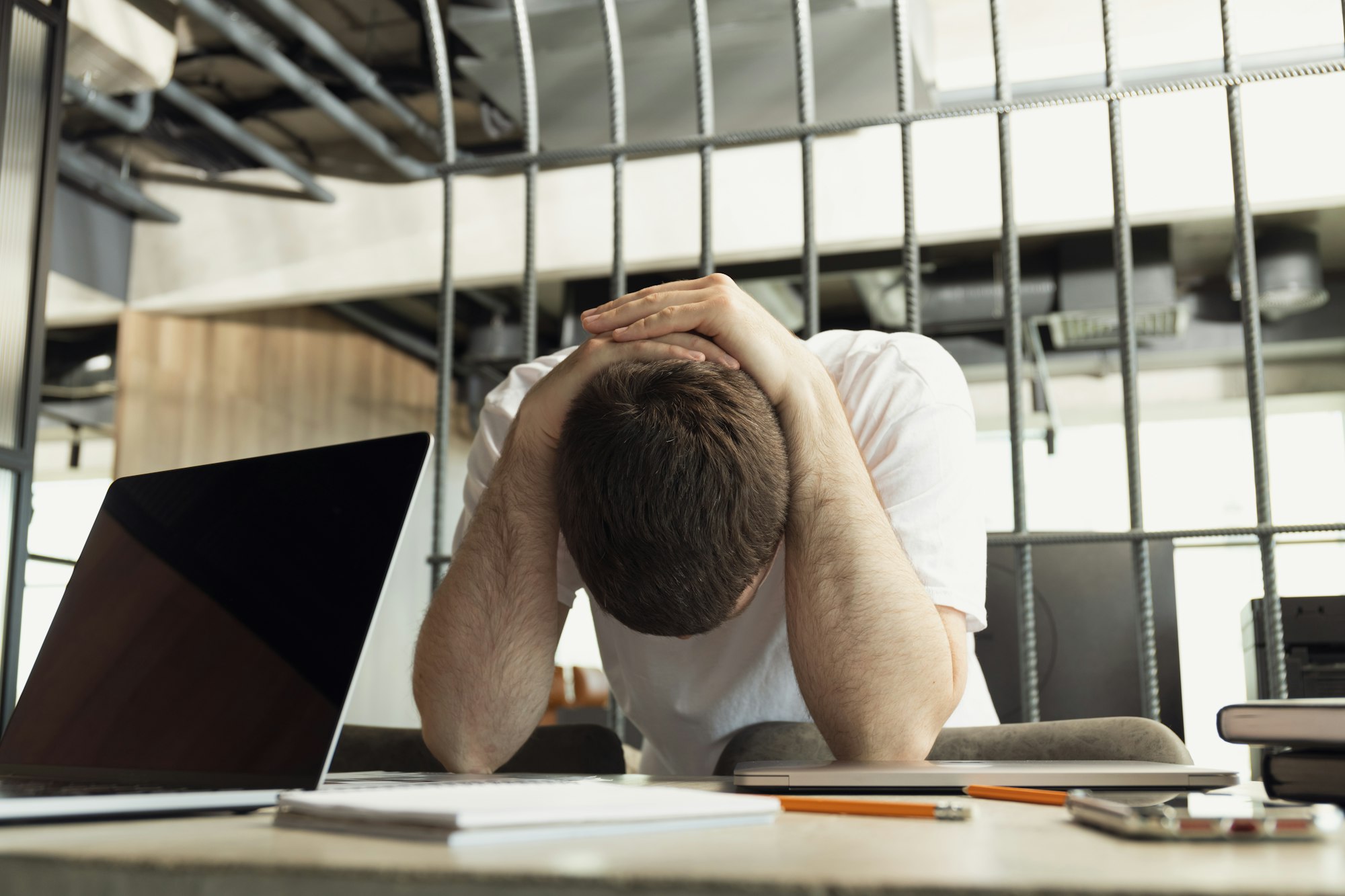 Tired man working in office, work in office concept